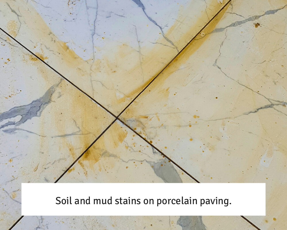 Soil and mud stains on porcelain paving